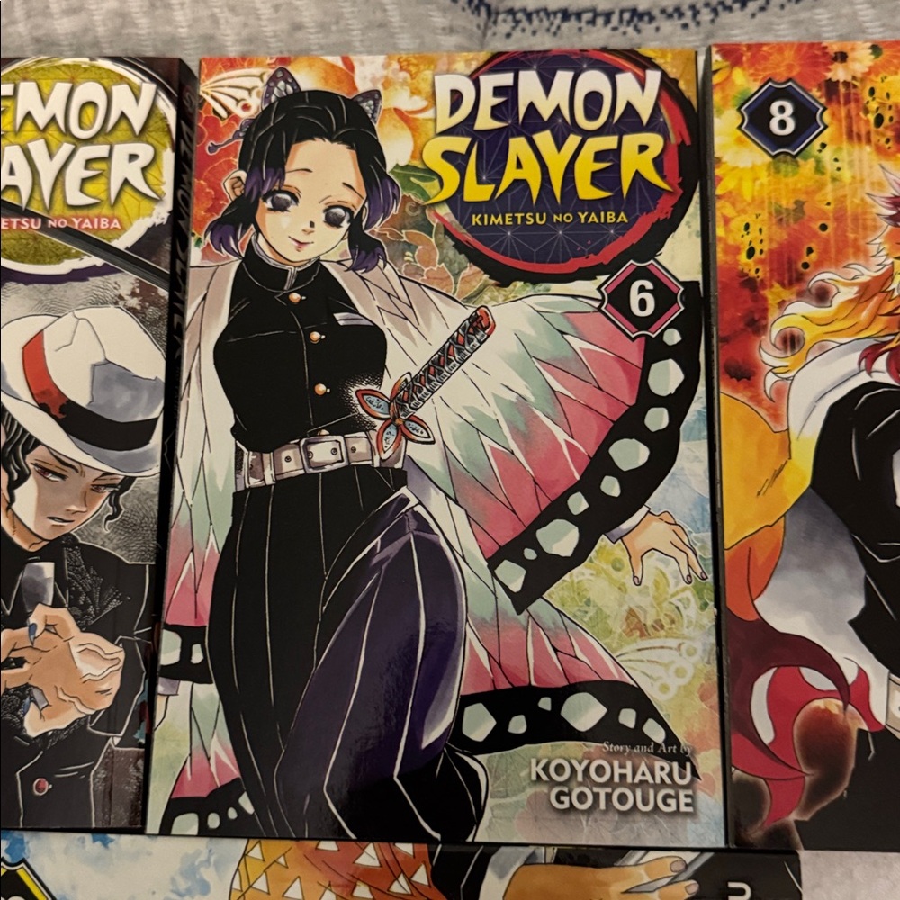 Manga Demon Slayer Volumes — Blue, Yellow, Black, Pink, Orange - Picture 3 of 5